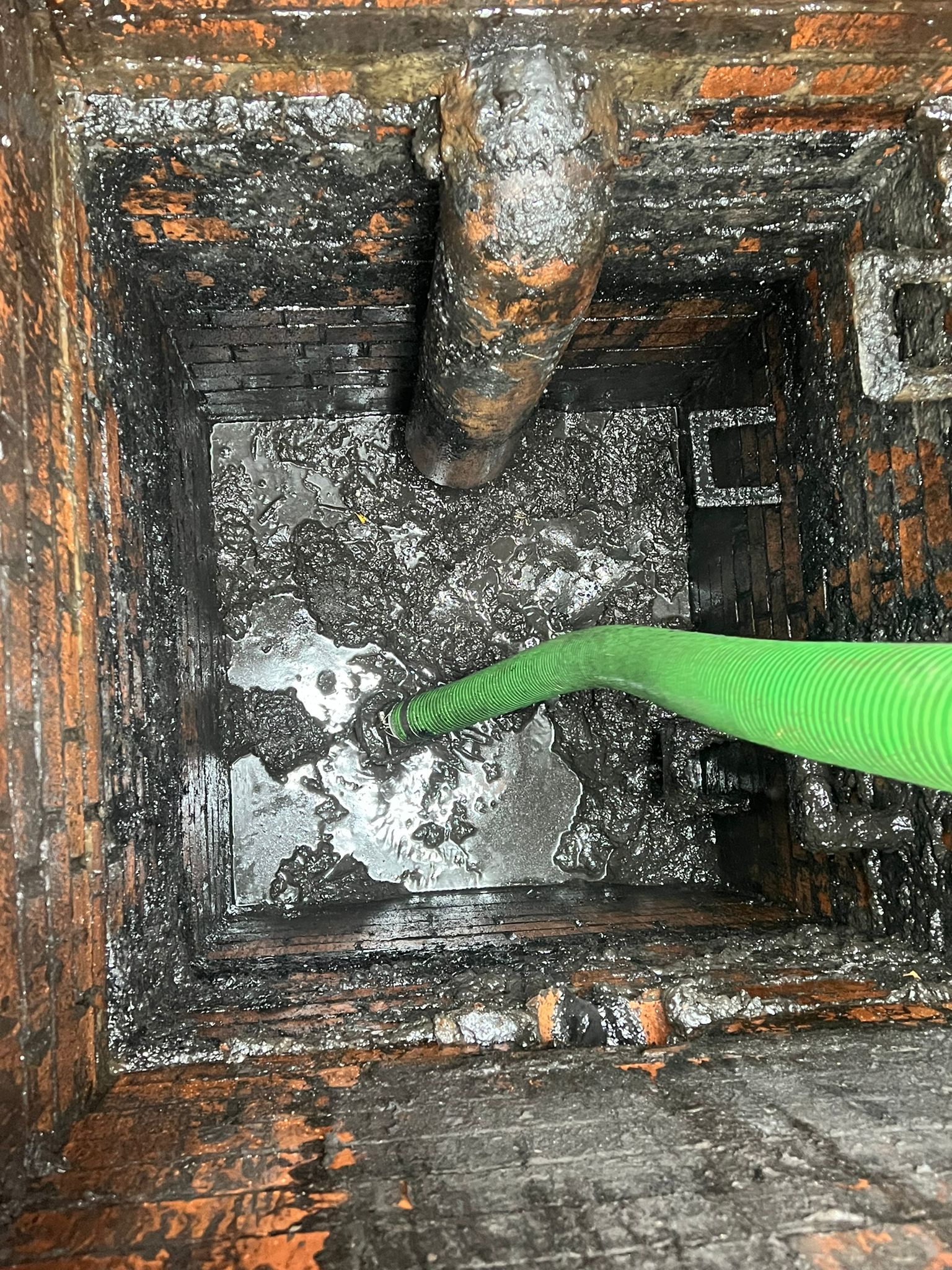 pipe down an interceptor cleaning out the debris